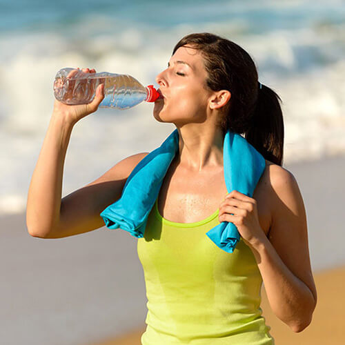 woman drinking water to prevent dehydration which boosts the immune system