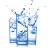 three glasses with splashing water