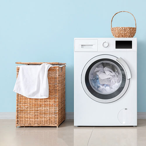 washing machine against blue background