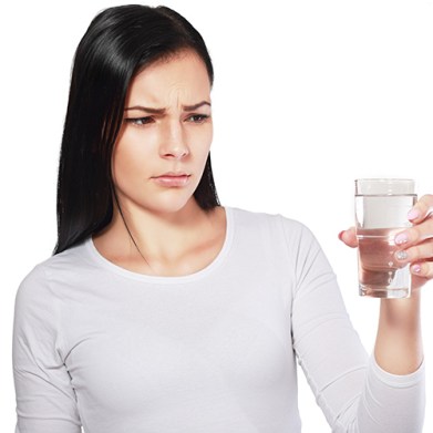 dangerous water young asian woman looking at water looking unhappy or disgusted; Shutterstock ID 347505044; team: Project management; job: Blog image; client: Culligan; purchase_order: Rachel