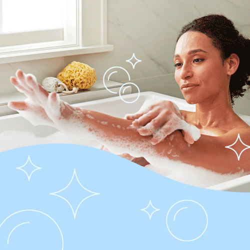 woman enjoying cleaner, soft Culligan water in bathtub