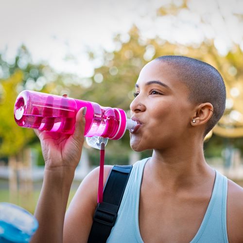 woman drinking from bpa-free water bottle