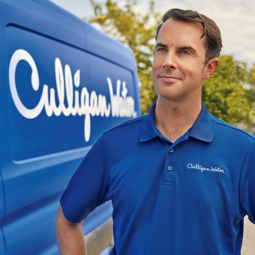 Culligan water expert outside of Culligan van