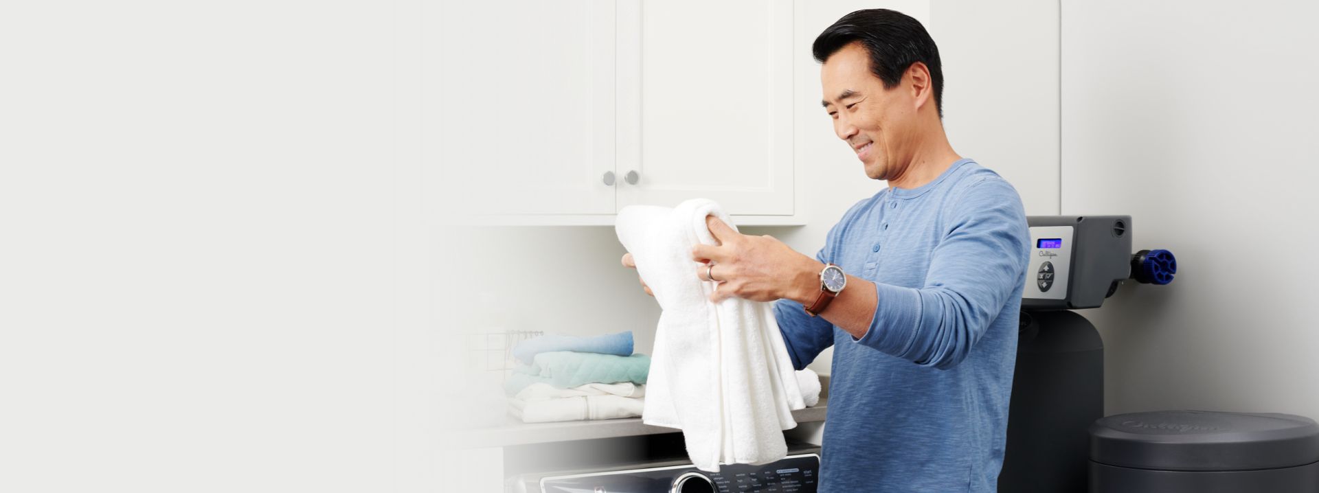 Man doing laundry using a soft water system