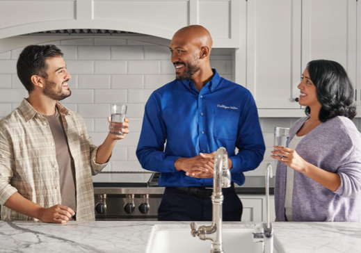 Culligan expert and couple discussing filtered water